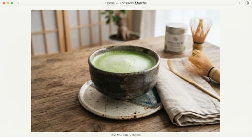 A sealed canister of matcha on a light stone surface
